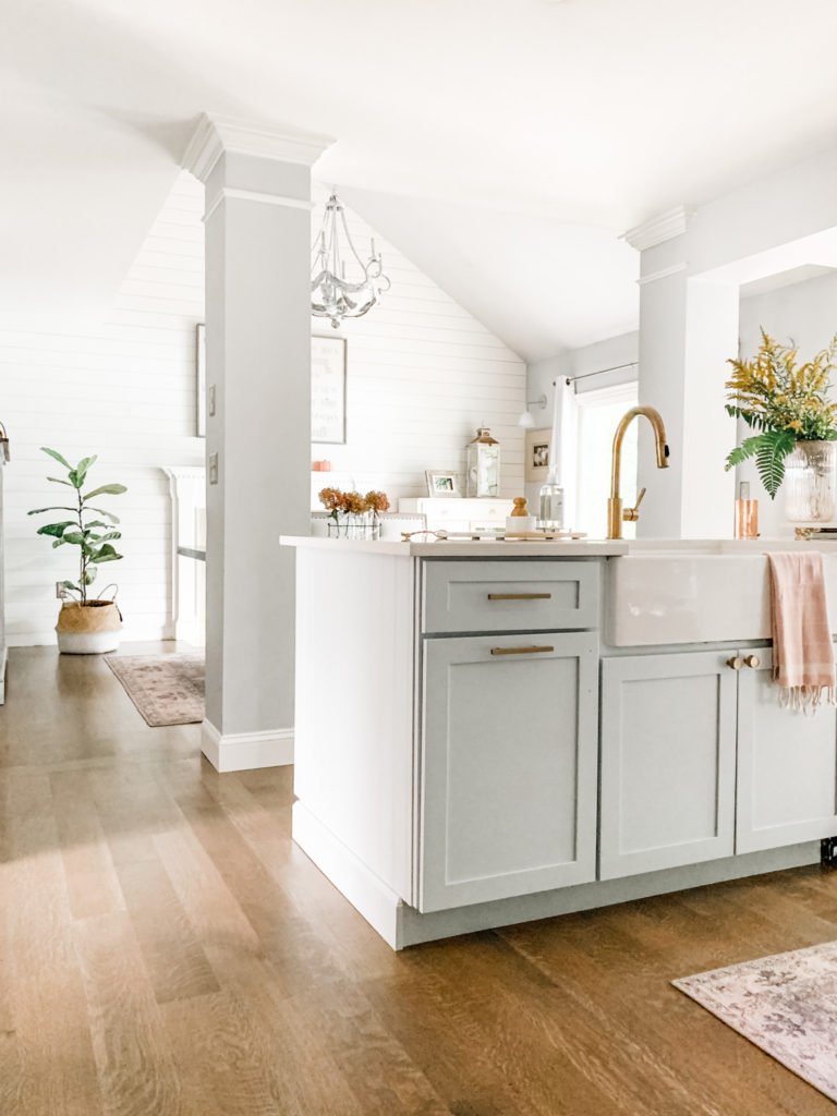 white-kitchen-shiplap-walls-blue-kitchen-island-farmhouse-sink-gold-faucet-farmhouse-style-home-with-heather