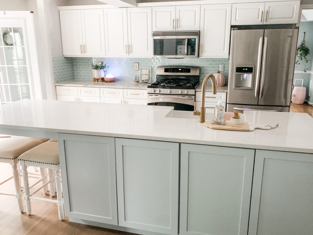 kitchen-island-table-painted-white-kitchen-cabinets-gold-hardware-farmhouse-sink-home-with-heather-krout-blog-local-designer-bel-air-harford-county-maryland