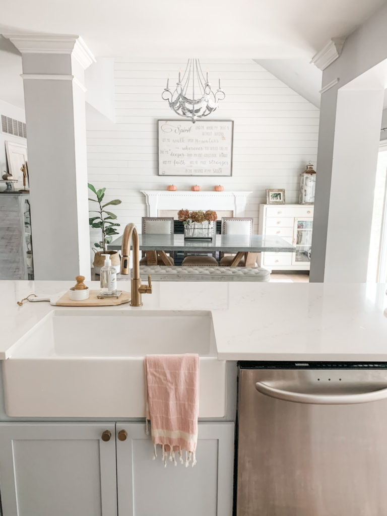 cottage-chic-kitchen-dining-room-quartz-countertop-farmhouse-sink-blue-kitchen-island-white-kitchen
